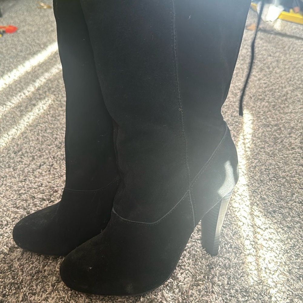 Knee high heeled black boots
